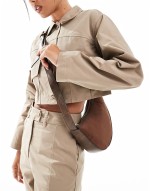 asymmetric scoop sling crossbody bag in brown