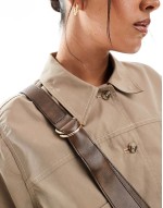 asymmetric scoop sling crossbody bag in brown