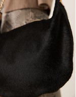 pony hair pouch clutch with gold hardware in black